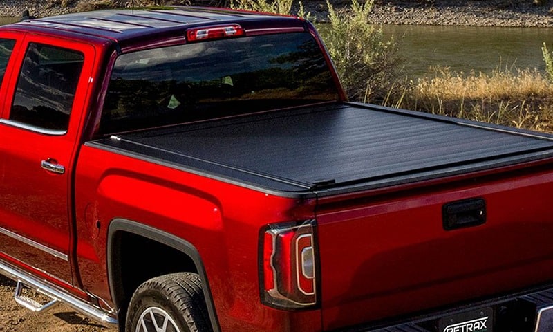 Black Tonneau Cover Truck Accessory on red truck